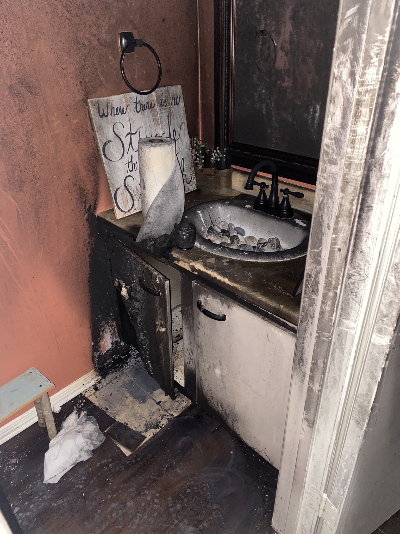 Fire and soot damage documented in a residential bathroom